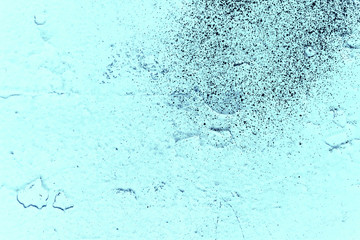 Vintage blue background. Rough painted wall of sapphire color. Imperfect plane of blue colored. Uneven old decorative toned backdrop of cyan tint. Texture of sapphirine hue. Ornamental stony surface.