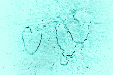 Vintage azure background. Rough painted wall of turquoise color. Imperfect plane of cyan colored. Uneven old decorative toned backdrop of aqzure tint. Texture of teal hue. Ornamental stony surface.