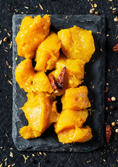 dices of spiced raw chicken meat