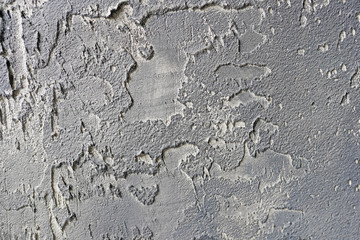 Old gray cement or concrete wall. Grunge plastered stucco textured background.