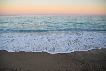 Sunset over sea horizon beach scene
