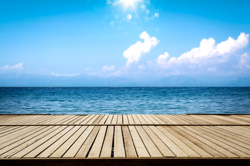 Obraz na płótnie Canvas Summer wooden pier of free space for your deoration and ocean landscape with sun light. 