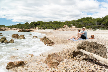 Couple in love enjoying a idyllic mediterranean beach.