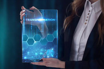 The concept of business, technology, the Internet and the network. A young entrepreneur working on a virtual screen of the future and sees the inscription: Transformation