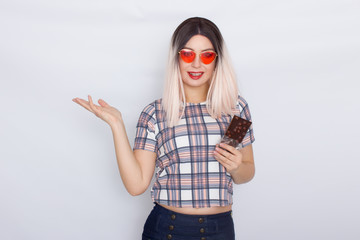 Blonde woman holding chocolate with nuts