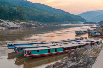 Naklejka premium Long boat on Mekong river, Laos