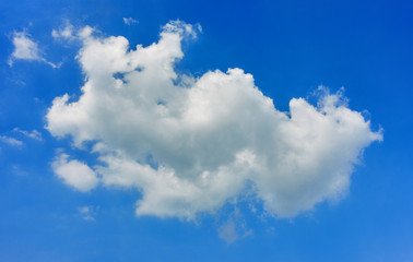 Obraz na płótnie Canvas White fluffy cloud on blue sky as a background