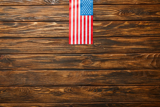 top view of american flag on wooden weathered background