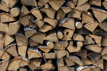 A texture birch firewood stacked on top of each other