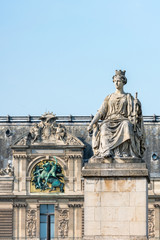 Fototapeta na wymiar Statue 'La Ville de Paris' at the Pont du Carrousel with Louvre museum in the background, Paris, France