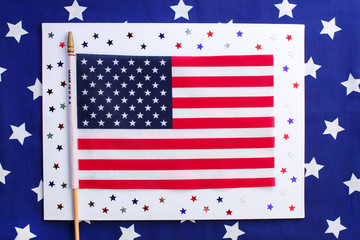 Obraz premium 4th of July. Concept for Independence Day with red and blue paper stars confetti and flag in national American colors. Independence day, card,