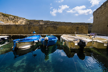Fototapeta na wymiar boats in a litlle old port in Puglia, Italy
