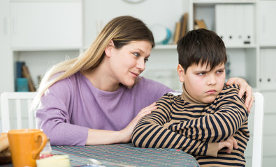 Mother wants to talk with his son after  conflict at table