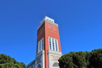 Pescara, Italy - Close up of the Pescara city hall with the clock tower, against clear sky.
