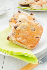 Hot buttered teacakes a traditional British sweet bun filled with raisins and a popular afternoon tea snack