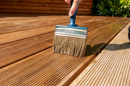 Brush Lies On The Wet Terrace With Glaze