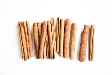 Set of cinnamon sticks on white background