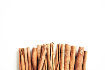 Set of cinnamon sticks on white background