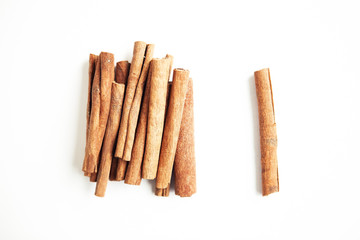 Set of cinnamon sticks on white background