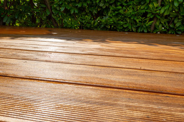 Fototapeta premium freshly painted with glaze embedded wooden terrace for weather protection