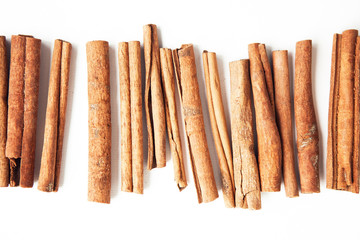 Set of cinnamon sticks on white background