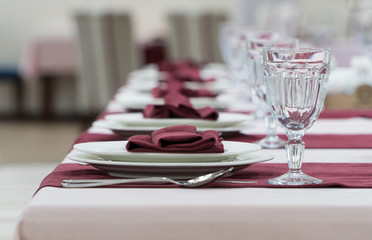 serving banquet table in a luxurious restaurant in pink and white style