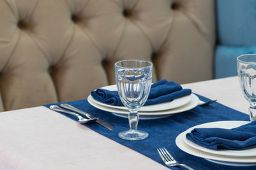 serving banquet table in a luxurious restaurant in blue and light style