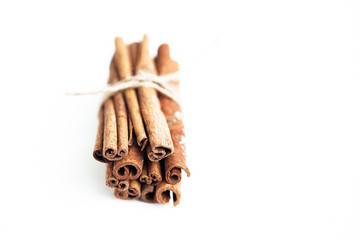 Set of cinnamon sticks on white background