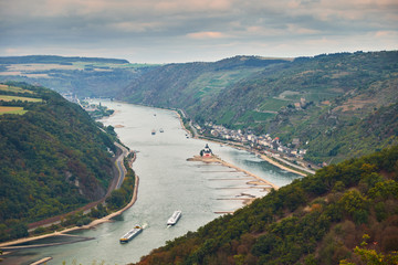Aerial view to hills of Rheinland-Pfalz land and Hesse land with river Rhine and Kaub town from tourist route