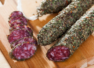 Fuet sausage coated with herbs