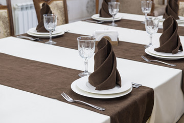 serving banquet table in a luxurious restaurant in brown and white style