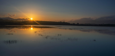 Sunrise view at the reservoir in Songkhla, Thailand.