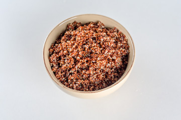 Cooked prep red quinoa in a bowl. Top view.