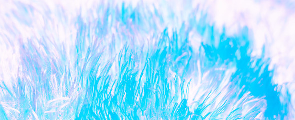 Texture of fluffy blue neon fabric in neon pastel colors. macro