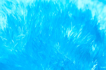Fototapeta na wymiar Texture of fluffy blue neon fabric in neon pastel colors. macro