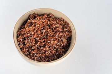 Cooked prep red quinoa in a bowl. Top view.