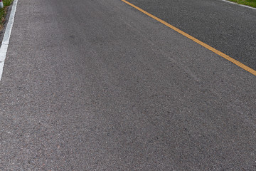 Asphalt road with marking lines white stripes texture Background.