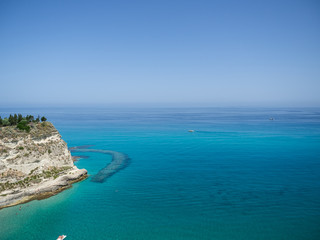 Aerial view of the beach of Tropea, the amazing seaside place in Calabria, Italy. The shot is taken during a beautiful sunny summer day