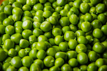 a lot of green peas. ripe beans