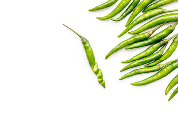 Cooking hot food with chilli pepper on white table background top view copy space
