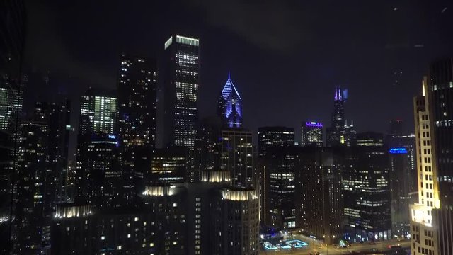 Chicago, IL/United States-May 25th 2019: view of the Chicago skyscrapers at night from a downtown high rise building. all the city lights illuminate the beautiful Chicago land 