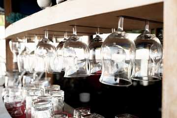 close-up hanging glasses on bar