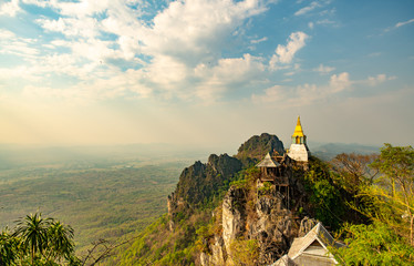 Wat chaloem phrachomklao rachanuson that the tample and pagoda on rock mountain in sunshine...