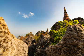 Wat chaloem phrachomklao rachanuson that the tample and pagoda on rock mountain in sunshine beautiful. Architecture landmark Lampang,Thailand