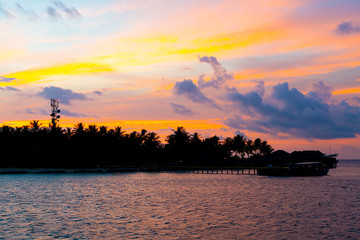 Naklejka premium sunset sky with Maldives Island