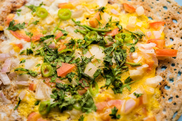 Egg Dosa is a popular south indian non-vegetarian breakfast or meal, served with sambar and chutney
