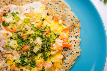 Egg Dosa is a popular south indian non-vegetarian breakfast or meal, served with sambar and chutney