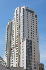 Fototapeta na wymiar Modern residential multi-storey house against the blue Sky