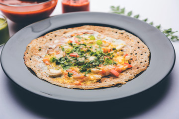 Egg Dosa is a popular south indian non-vegetarian breakfast or meal, served with sambar and chutney