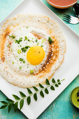 Egg Dosa is a popular south indian non-vegetarian breakfast or meal, served with sambar and chutney